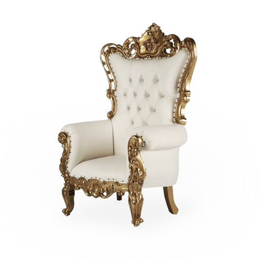 A white and gold throne chair displayed at a wedding